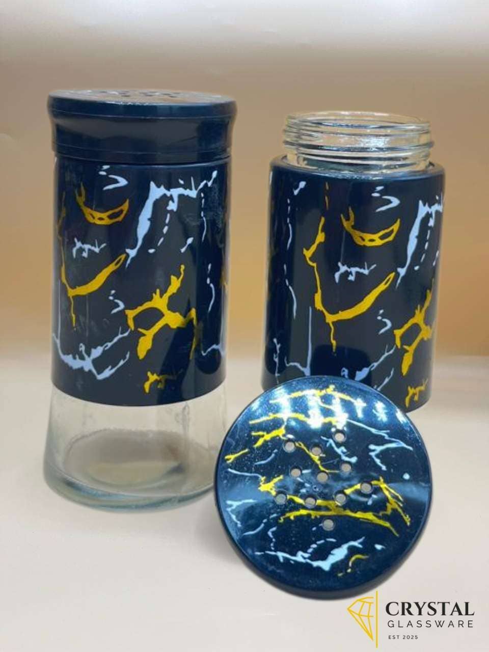 salt and pepper cellar, glass spice jar, marble print container, salt jar, pepper jar, seasoning pot, kitchen spice set, condiment holder, black marble kitchen decor, glass jars with lids, spice organizer, salt pepper shaker, modern kitchen accessories, table condiments, stylish glass container, decorative spice storage, salt pepper pot.