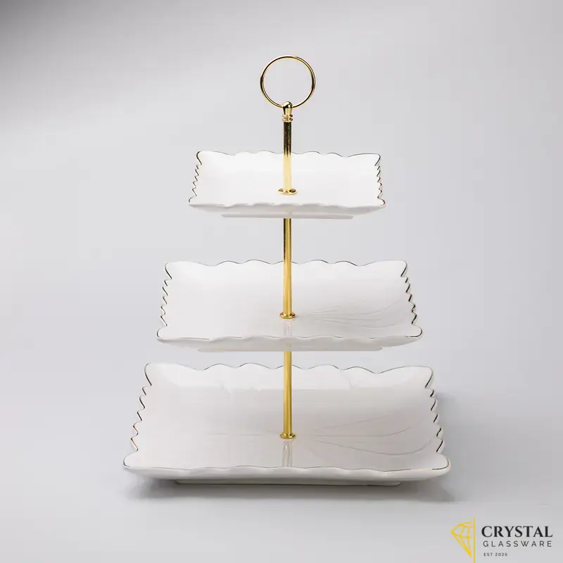 3-tier white ceramic cake stand with gold accents