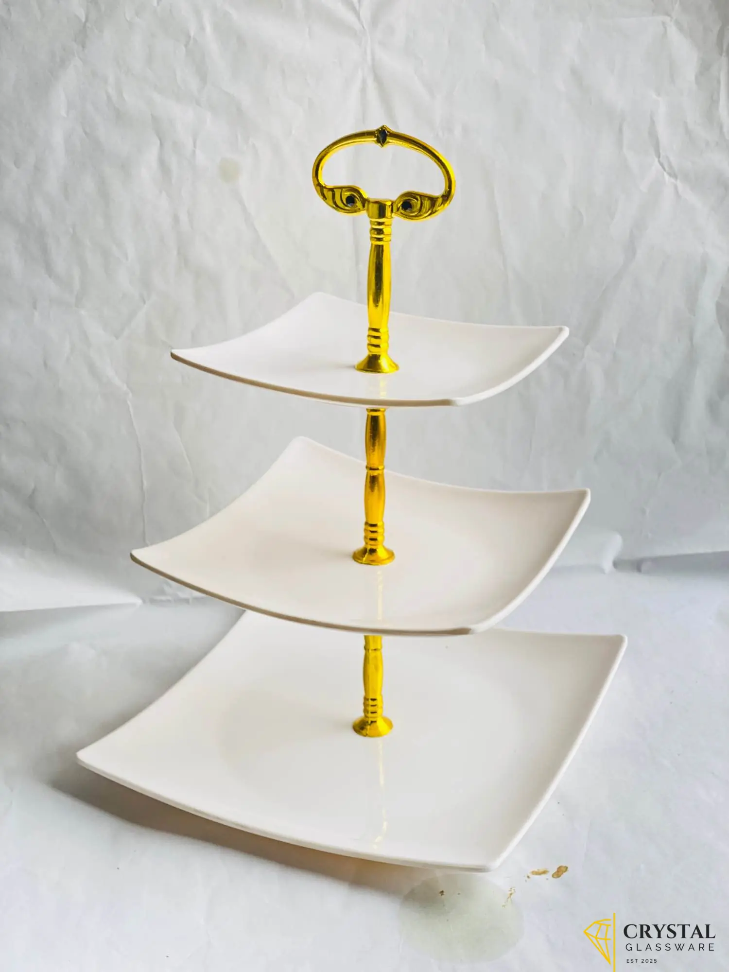 3-tier white ceramic cake stand with gold accents