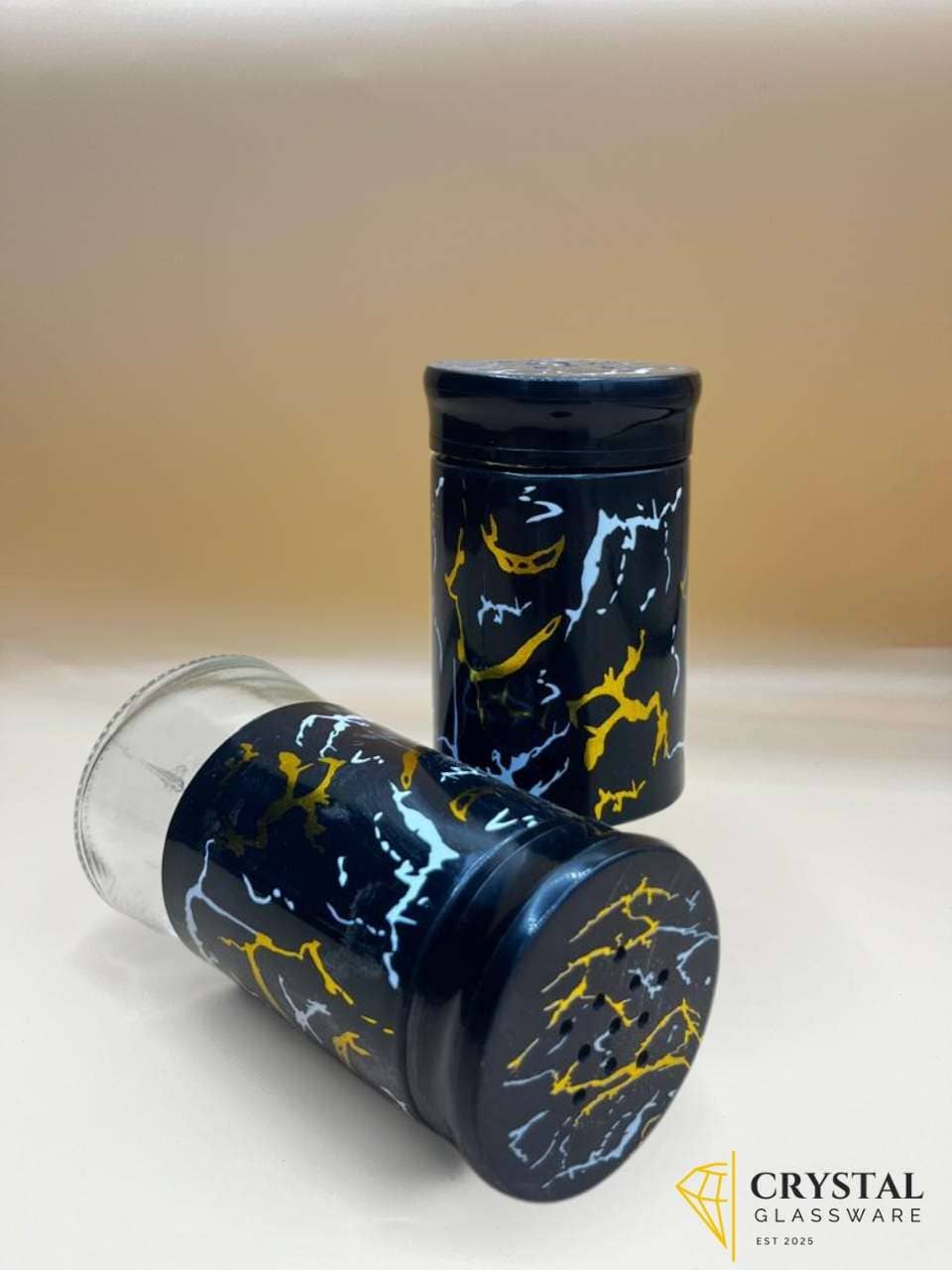 salt and pepper cellar, glass spice jar, marble print container, salt jar, pepper jar, seasoning pot, kitchen spice set, condiment holder, black marble kitchen decor, glass jars with lids, spice organizer, salt pepper shaker, modern kitchen accessories, table condiments, stylish glass container, decorative spice storage, salt pepper pot.